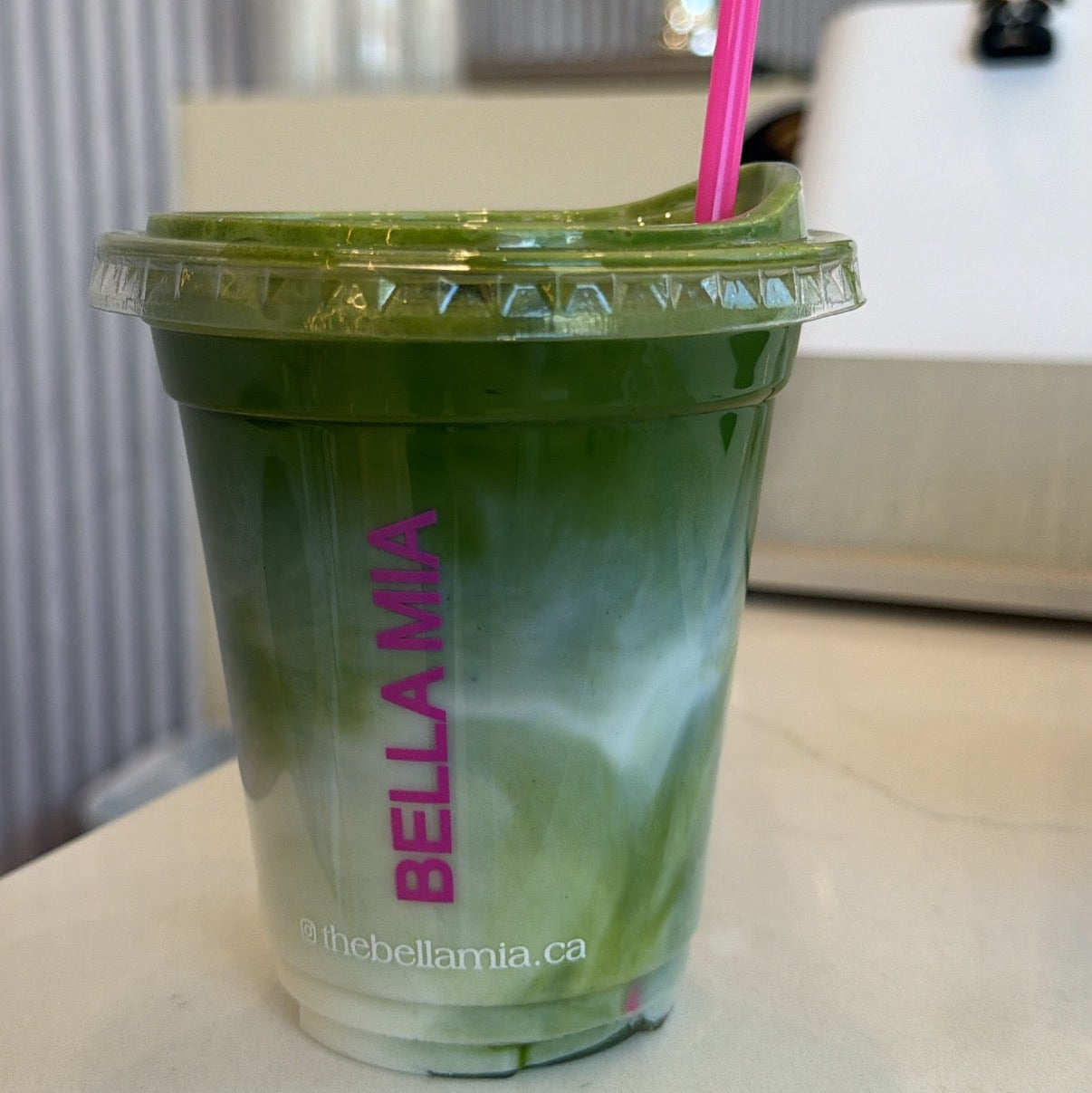 Matcha drink in a Bella Mia cup, featuring the BellaMia brand